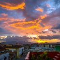 CUB SDEC SantiagoDeCuba 2019APR19 CasaThay 005  Beers in hand, great company and a brilliant sunset - what more could you want? : - DATE, - PLACES, - TRIPS, 10's, 2019, 2019 - Taco's & Toucan's, Americas, April, Caribbean, Casa Thay, Cuba, Day, Friday, Month, Santiago de Cuba, Year